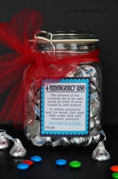 an emergency use jar filled with candy and candies for the teacher's day