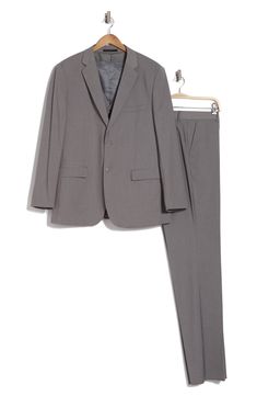 Bring understated elegance to the table in this three-piece suit crafted from rich fabric in a classic single-breasted silhouette. Jacket has notched lapels; chest welt pocket; front flap pockets Vest has front button closure; V-neck Pants have zip fly with button closure; front slant pockets; back button-welt pockets Jacket and vest are lined; trousers are lined to the knee 65% polyester, 35% viscose Dry clean Imported Suit has a 6” drop, meaning that a size 38R jacket is paired with size 32 pa Classic Notched Suits With Welt Pockets, Tailored Single Breasted Set With Notch Lapel, Classic Business Sets With Collared Suit, Classic Business Sets With Suit Collar, Classic Single Breasted Business Sets, Classic Tailored Single Breasted Sets, Classic Office Sets Single Breasted, Tailored Sets With Notch Lapel And Hidden Button Closure, Classic Notched Business Suits