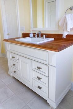 a bathroom with two sinks and a mirror