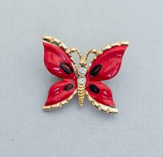 Vintage Red Butterfly Rhinestone Brooch CY1 Store Notes - This is the exact item you'll receive!  - USPS first class within 1 business day of purchase.  - Items are packaged in a jewelry box unless they are too big.  - Open to best offer - If you have any questions please ask! Thanks Tags Vintage Brooch, Vintage Broach, Broach, Brooch, Brooches, Grandma Brooch, Girls Brooch, Ladies Brooch, Fashion Brooch, Ladies Broach, Fashion Broach, Grandma Broach, Gift For Her, Costume Brooch, Costume Broach Red Enamel Brooch Pin For Gift, Red Enamel Brooch Gift, Red Enamel Brooch For Gift, Red Enamel Brooches For Gift, Red Enamel Brooches As Gift, Red Enamel Pin Gift, Red Enamel Pin As Gift, Red Enamel Pin For Gift, Red Enamel Pins For Gifts