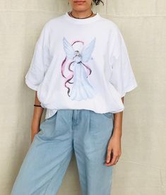 90's oversized Angel Tshirt 100% Cotton One Size Fits All Modeled on a Size Small Made in the USA Oversized Y2k Short Sleeve T-shirt, Oversized Y2k T-shirt With Screen Print, Oversized Y2k T-shirt With Short Sleeves, 90s Inspired Oversized Crew Neck T-shirt, Oversized 90s T-shirt With Crew Neck, Oversized Crew Neck T-shirt Inspired By 90s, Oversized 90s Inspired Crew Neck T-shirt, Oversized 90s Crew Neck T-shirt, Oversized 90s Inspired Streetwear T-shirt