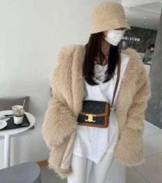 Winter White Fluffy Fur Coat For Winter, Fluffy Winter White Fur Coat For Winter, Winter White Fluffy Long Sleeve Outerwear, Fluffy Winter White Fur Coat For Fall, Trendy Fur Coat For Cold Winter Weather, Trendy Winter Fur Coat For Cold Weather, Fluffy Beige Fur Coat For Winter, Winter Beige Fluffy Fur Coat, Winter Faux Fur Outerwear