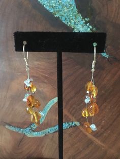 "MOTHER's Day Promotion!! Free Gift wrapping! Just place a note on comments indicating it is a gift and any personal note you would like to add! These fun and stylish natural stone earrings are perfect for everyday, appearances, or interview! Size of earrings: 2.75\" Long. Stones: natural baltic amber beads and aquamarine chips Post: sterling silver long earwires Looking for the perfect pair of earrings for a special occasion. We specialize in custom work in fashion jewelry, pearls, and natural Orange Citrine Earrings Gift, Amber Citrine Earrings With Ear Wire, Amber Dangle Earrings As Gift, Amber Dangle Earrings For Gift, Amber Dangle Earrings For Anniversary, Baltic Amber Dangle Earrings, Amber Citrine Dangle Earrings, Amber Dangle Earrings In Baltic Amber, Handmade Amber Earrings For Anniversary