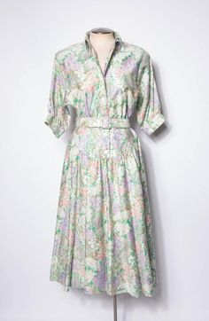 Vintage Cotton Summer Dress Women's Maxi Dress Belted Green Floral Pattern Sz 10 This is a beautiful spring floral cotton maxi dress. I think it is from the late 80s or early 90s. The fabric is 100% cotton, super breathable, and very comfortable to wear. Kinda pale pastel garden party vibes. Or maybe Steel Magnolia vibes. Made of a gorgeous printed cotton in greens, pinks, purple, and white. The front unbuttons down to the waist. This would be a great dress for a summer wedding or for some gorgeous picnics.  Excellent vintage condition. Light wear from age.  This dress has pockets! Includes a matching belt.  Tag size 10 Measurements  Chest 21" across or 42" doubled Waist 15" across or 30" doubled Hips up to 31" across or 62" doubled Neck to skirt hem 49"   Belt 29-32" Brand: Strait Line 10 Spring Cotton Midi Dress With Floral Print, Spring Floral Cotton Midi Dress, Spring Vintage Floral Print Midi Dress, Spring Vintage Midi Dress With Floral Print, Spring Vintage Maxi Dress, Vintage Maxi Spring Dresses, Vintage Midi Dress For Daywear In Spring, Vintage Maxi Dress For Spring, Retro Spring Maxi Dress For Daywear