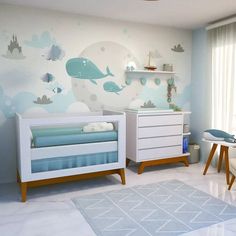 a baby's room with blue and white decor