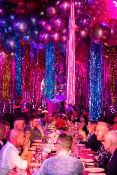 a group of people sitting around a dinner table