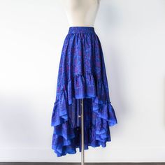 This bohemian hi low ruffle skirt is full of sway and flow. It's a graceful, romantic maxi skirt that's hits at the knee in the center front and drapes beautifully all the way around. A full twirling skirt, this can easily be paired with flats for a day at the beach, or paired with our infinity convertible tops for a more formal occasion. It's lightweight, easy to wash/dry and so easy to pack for all your vacations! Note: You will be stopped and admired when you wear this out! ► Size XS & S of P Bohemian Robes, Hi Low Skirt, Bohemian Maxi Skirt, Flare Maxi Skirt, Long Floral Skirt, Hi Low Skirts, Modern Kimono, Ruffle Maxi Skirt, Skirt Ruffle