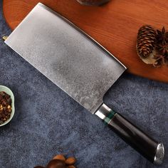 a knife and some nuts on a table