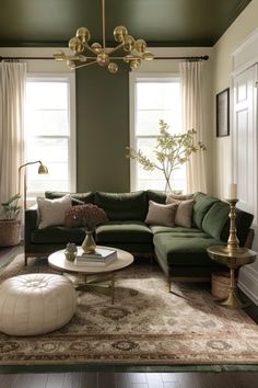 a living room with green couches and rugs on the floor, windows in the background