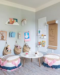 a child's room with stuffed animals on the wall and other toys in baskets