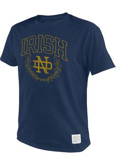 Support your Notre Dame Fighting Irish in this Navy Blue Short Sleeve Fashion Tee! This Arch Logo Fashion T Shirt features a team name and logo on front chest. Be ready to shout "Loyal to Notre Dame" when you wear this Fighting Irish Short Sleeve Fashion T Shirt in the stadium or on the street. Vintage screen print, Soft light weight cotton, Slimmer fit, Tagless neckline, Straight hemline, Unisex, Fit: Runs Small, 100% COTTON, Machine wash, 4 Navy Collegiate T-shirt With Letter Print, Navy Collegiate T-shirt For College, University Logo Crew Neck Top For Fan Gear, Navy Collegiate Style T-shirt For College, Collegiate Style Navy T-shirt For College, Collegiate Navy T-shirt With Letter Print, Navy Collegiate Style T-shirt With Letter Print, University Logo Crew Neck Top Fan Apparel, University Logo Short Sleeve Fan Apparel Top