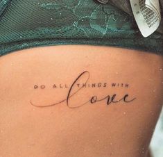 a woman's stomach with the words do all things with love written on it