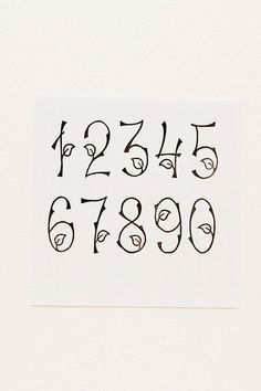 the letters and numbers are drawn in black ink on white paper, which has been placed next to each other