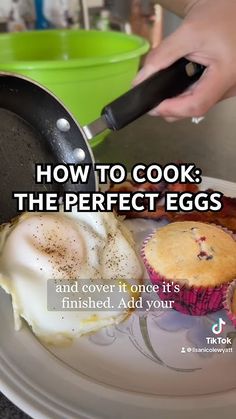 a person is cooking eggs on a plate