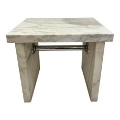 a white marble side table with metal legs and an open drawer on the top, against a white background