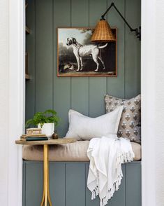 a dog is standing in the corner of a room with green painted wood paneling