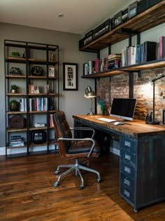 a desk with a laptop computer on top of it next to a bookshelf