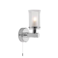 a chrome wall light with a glass shade