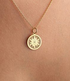 14K Real Solid Gold sun gold necklace ● Material of pendant: Solid Gold 14k ( REAL GOLD ) ● Metal Stamp: 14L ( REAL GOLD ) ● The pendant is available in 6 sizes: - 14,0 mm / 0,55 inches ( Diameter ) In the photos - 15,3 mm / 0.60 inches ( Diameter ) - 16,5 mm / 0,65 inches ( Diameter ) - 19,1 mm / 0,75 inches ( Diameter ) - 21 mm / 0,82 inches ( Diameter ) - 23 mm / 0.90 inches ( Diameter ) ( In the photos the size is 14mm / 0.55 inches Diameter ) ( Jump Ring inner diameter: 4 mm ) ● Material Of 14k Gold-filled Yellow Gold Medallion Charm Necklace, Yellow Gold Medallion Charm Necklaces, Gold Celestial Necklace With Polished Finish, Celestial Engraved 14k Gold Necklace, Engraved Celestial 14k Gold Necklace, Celestial Yellow Gold Jewelry With Charms, Celestial Style Yellow Gold Jewelry With Charms, Symbolic 14k Gold Pendant Necklace, Celestial Style Yellow Gold Tarnish Resistant Jewelry