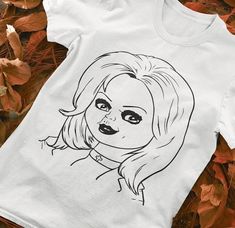 a t - shirt with a drawing of a woman's face on it