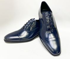 Style: Corrente Cordovan Leather Lace-Up Blue Elegant Cordovan Leather lace-up Oxford from the Exclusive Corrente collection features a Cap-Toe, soft Calfskin lining, a clean welt and a full Leather Sole! Elegant Formal Oxfords With Laces, Elegant Fitted Oxfords With Laces, Luxury Fitted Leather Shoes For Office, Luxury Fitted Leather Office Shoes, Elegant Blue Lace-up Oxfords, Luxury Blue Leather Shoes For Business Casual, Elegant Leather Derby Shoes With Laces, Elegant Oxfords For Business With Laces, Elegant Laced Oxfords For Business