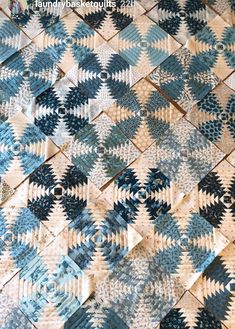 a blue and white quilt is on display