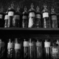 many jars are lined up on the shelf