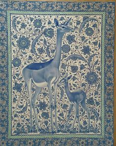 a blue and white wall hanging with an image of a giraffe and its baby