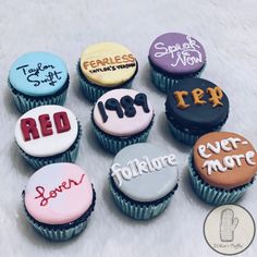 nine cupcakes with different colored frosting on them