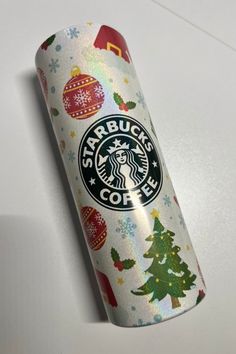 a starbucks coffee can with christmas decorations on it