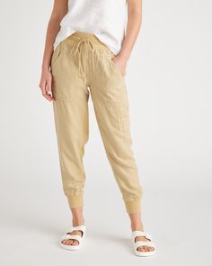 These pants are comfort in the form of a jogger. Featuring an elastic waistband and a drawstring waist for the perfect, cozy fit. The fabric is super soft and perfect for everyday wear. Plus, the front carpenter and back patch pockets give them added functionality and versatility. Lyocell is a biodegradable fabric made from cellulose found in wood pulp. It is softer, more breathable, and uses 10-20 times less water in production compared to cotton. Travel Pants, Casual Evening, Linen Short, Cozy Fits, Just Run, Fleece Pants, Weekend Wear, Khaki Color, Back Patch