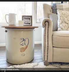 a chair and ottoman in front of a window with the number 30 on it's side