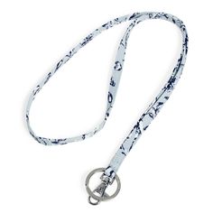 Enjoy all the hands-free functionality of a classic lanyard. Holds your keys and badge close where you can quickly access them and also avoid misplacing them. A win-win. Key ring Badge clip. Dimensions: 0. 5" w x 18. 5" h Handle/Strap strap length 18. 5" Vera Bradley Outlet Lanyard in Perennials Gray Sling Backpack Purse, Lanyard Wallet, Signature Rings, Work Backpack, Paper Store, Travel Luggage Tag, Cozy Gift, Crossbody Wallet, Mini Purse