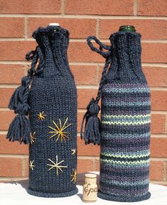 two knitted vases sitting next to each other