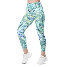 The Gearbunch Blue and Green Paisley Leggings is a calming and peaceful mix of soft blue, green and white, with a touch of pink and purple are perfect for summer workouts. Featuring a classic, high-waisted cut, exceptional comfort, and two practical side pockets, these leggings will support you during gym workouts, dance, yoga, and all you favorite sports and hobbies. Be Bright, Be Happy, Be You with Gearbunch. Casual Green Leggings For Gym, Green Sportswear Bottoms For Yoga, Casual Blue Activewear For Yoga, Green Moisture-wicking Leggings For Yoga, Green Moisture-wicking Yoga Leggings, Green Athleisure Yoga Pants, Casual Green Leggings For Pilates, Blue Moisture-wicking Casual Yoga Pants, Casual Blue Moisture-wicking Yoga Pants