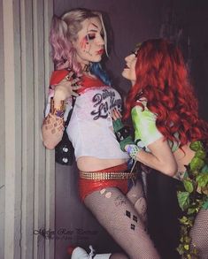 two women dressed up in costumes standing next to each other