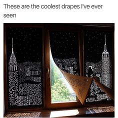 the window is decorated with black and white cityscapes