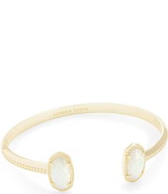 A dainty pinch cuff bookended with our signature oval stones&#x2C; the Elton Gold Cuff Bracelet in Black Opaque Glass is a stack staple. This beautifully designed gold cuff bracelet is guaranteed to turn heads every time you wear it. No matter the size of your wrist&#x2C; our Elton Cuff Bracelet is sure to fit you and your style.From Kendra Scott&#x2C; this bracelet features:14k gold plated over brassOpen&#x2C; adjustableApprox. 0.63" L x 0& Elegant Adjustable Cream Bangle, Elegant Cream Adjustable Bangle, Gold Cuff Bracelet, Spring Event, Gold Bracelet Cuff, Gold Cuffs, Oval Stone, White Opal, Kendra Scott