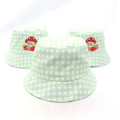 Limited Edition Marshall Strawberry Bucket Hat! Details: 57.5-58cm hat size Green gingham print Embroidered design Retro Spring Sun Hat Cap, Retro Spring Sun Cap, Spring Bucket Hat With Curved Brim For Picnic, Spring Curved Brim Bucket Hat For Picnic, Curved Brim Bucket Hat For Spring Picnic, Cute Green Spring Hat, Cute Cotton Wide Brim Hats, Cute Wide Brim Cotton Hat, Summer Cotton Hat For Picnic