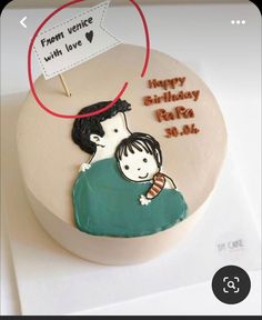 a birthday cake with an image of a man holding a child