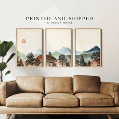 three paintings are hanging on the wall above a couch in front of a potted plant