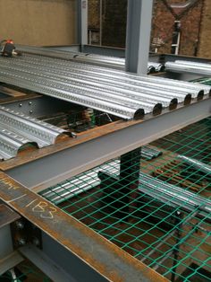 an assembly line in a factory with metal bars