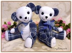 two stuffed animals sitting next to each other on a bed with flowers in the background