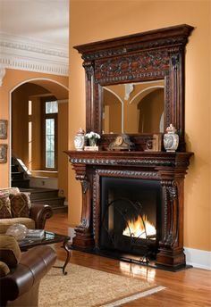 a living room with a fireplace and mirror