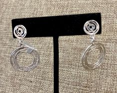 Handmade with a unique abstract circle design with a post. .925 sterling silver. Spiral Nickel-free Jewelry For Anniversary, Sterling Silver Spiral Earrings For Formal Occasions, Sterling Silver Clip-on Hoop Earrings As Gift, Silver Open Circle Earrings For Pierced Ears, Formal Sterling Silver Spiral Earrings, Unique Round Clip-on Jewelry, Hypoallergenic Spiral Sterling Silver Jewelry, Pierced Open Circle Jewelry Gift, Contemporary Silver Pierced Jewelry