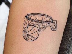 a black and white photo of a basketball hoop tattoo on the right thigh, with lines running through it