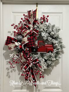 a christmas wreath with a red truck on it