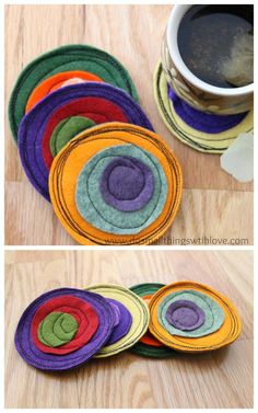 several pieces of felt sitting on top of a wooden table next to a cup of coffee