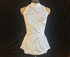 a woman's white dress on a mannequin