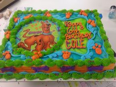 the birthday cake is decorated with an image of scooby's dog and paw prints